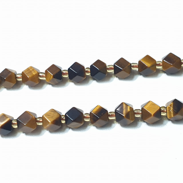 Бусины тигровый глаз крупная грань 7мм. нить 42шт.